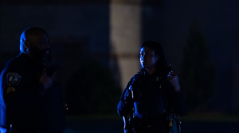 Emory police stand on the quad after clearing protesters. Police cleared the quad Saturday night after someone began spray painting the convocation center.Protesters gather for the third day on the Emory University quad. Saturday, April 27 , 2024 (Ben Hendren for the Atlanta Journal Constituion)