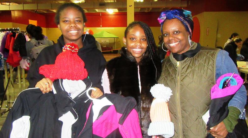 Participants at the 2018 Warm Coat Day of North Fulton Community Charities check out the selection of donated apparel. This year’s coat drive is under way, with a distribution set for Saturday, Oct. 26. NORTH FULTON COMMUNITY CHARITIES