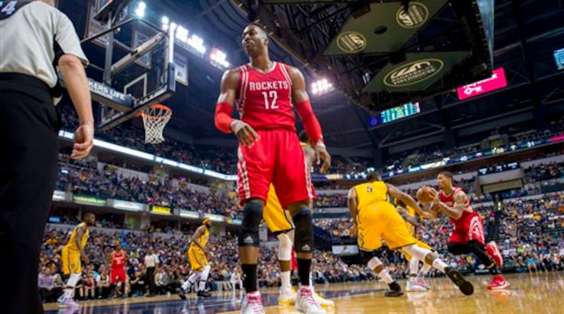 Houston Rockets center Dwight Howard (12) turns to complain toward an official after believing he had been fouled during an NBA basketball game against the Indiana Pacers, Sunday, March 27, 2016, in Indianapolis. The Pacers won 104-101. (AP Photo/Doug McSchooler)