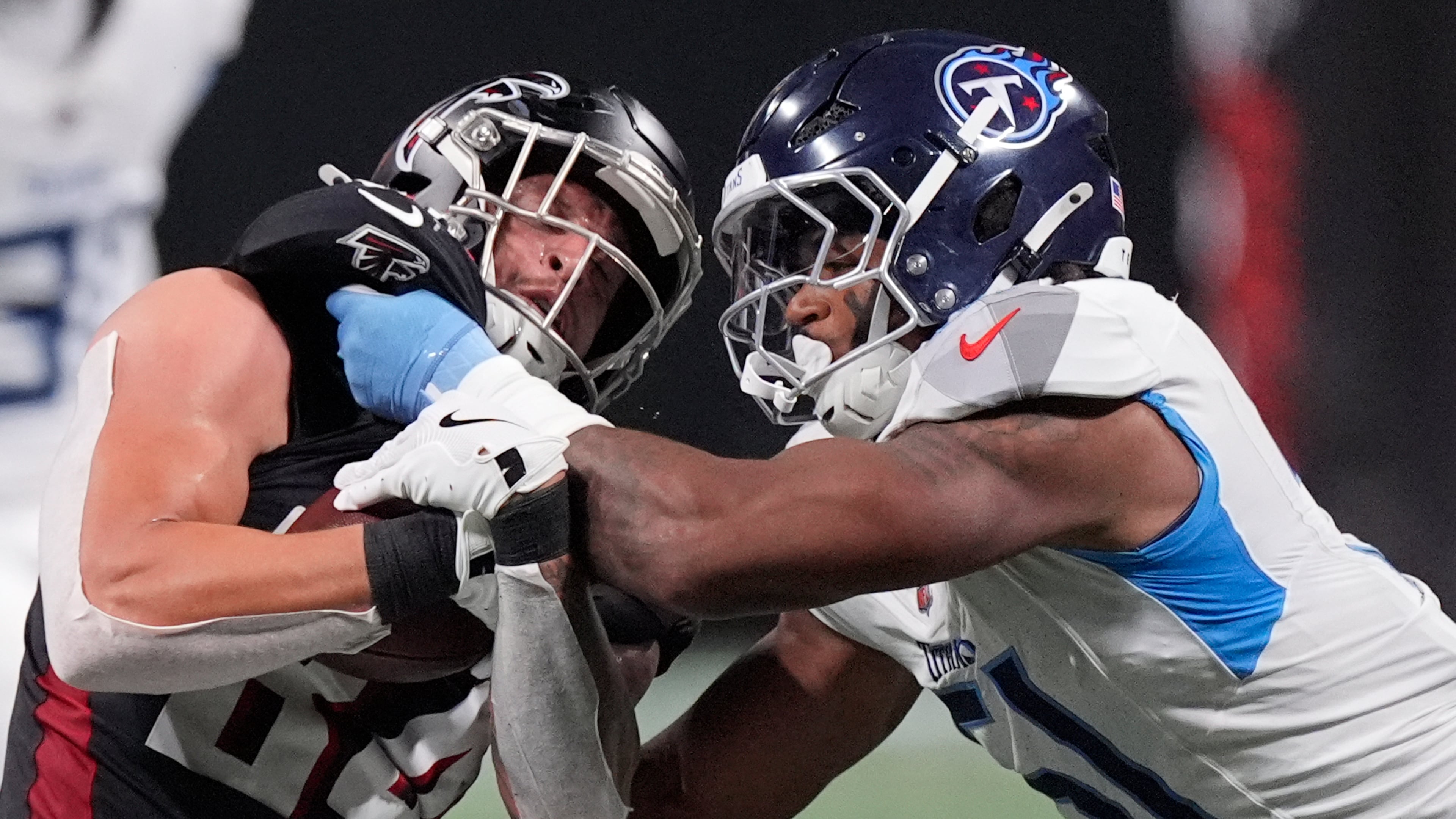 Tennessee Titans linebacker Cedric Gray (right) tackles Atlanta Falcons tight end Feleipe Franks (left) during the first half of a preseason NFL football game, Friday, Aug. 15, 2025, in Atlanta. (Mike Stewart/AP)