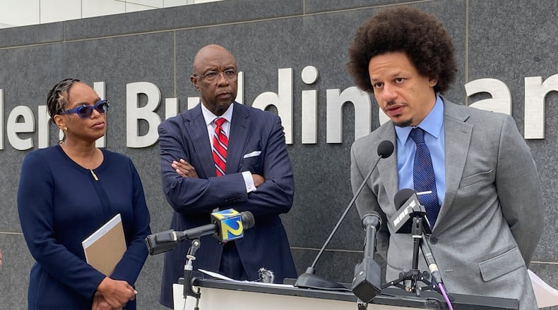 FILE - Comedian Eric André, right, speaks at a news conference outside the federal courthouse in Atlanta on Oct. 11, 2022, as his attorneys Allegra Lawrence-Hardy, left, and Richard Deane watch. (AP Photo/Kate Brumback, File)
