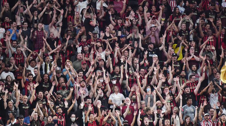 Atlanta United fans cheer for their team during the first half in a MLS soccer match at Mercedes-Benz Stadium in Atlanta on Sept. 10, 2021. (Hyosub Shin / Hyosub.Shin@ajc.com)