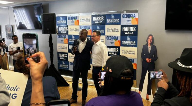 Democratic U.S. Sen. Raphael Warnock and Pennsylvania Gov. Josh Shapiro, another Democrat, campaign together earlier this month in Georgia for Vice President Kamala Harris.
