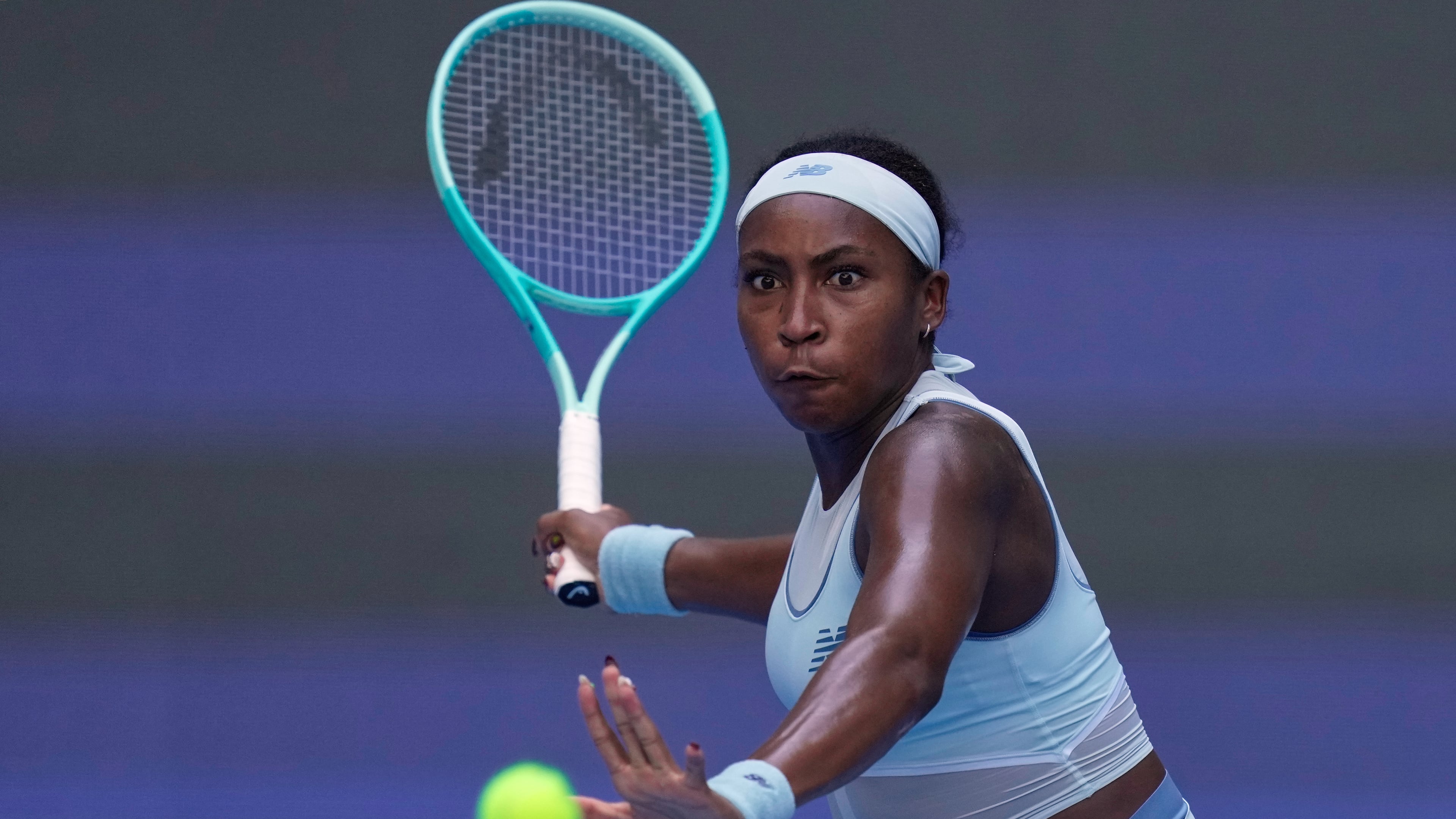 Coco Gauff of the United States plays a forehand return to Leylah Fernandez of Canada during the women's singles match for the China Open tennis tournament at the National Tennis Center in Beijing, China, Sunday, Sept. 28, 2025. (AP Photo/Mahesh Kumar A.)