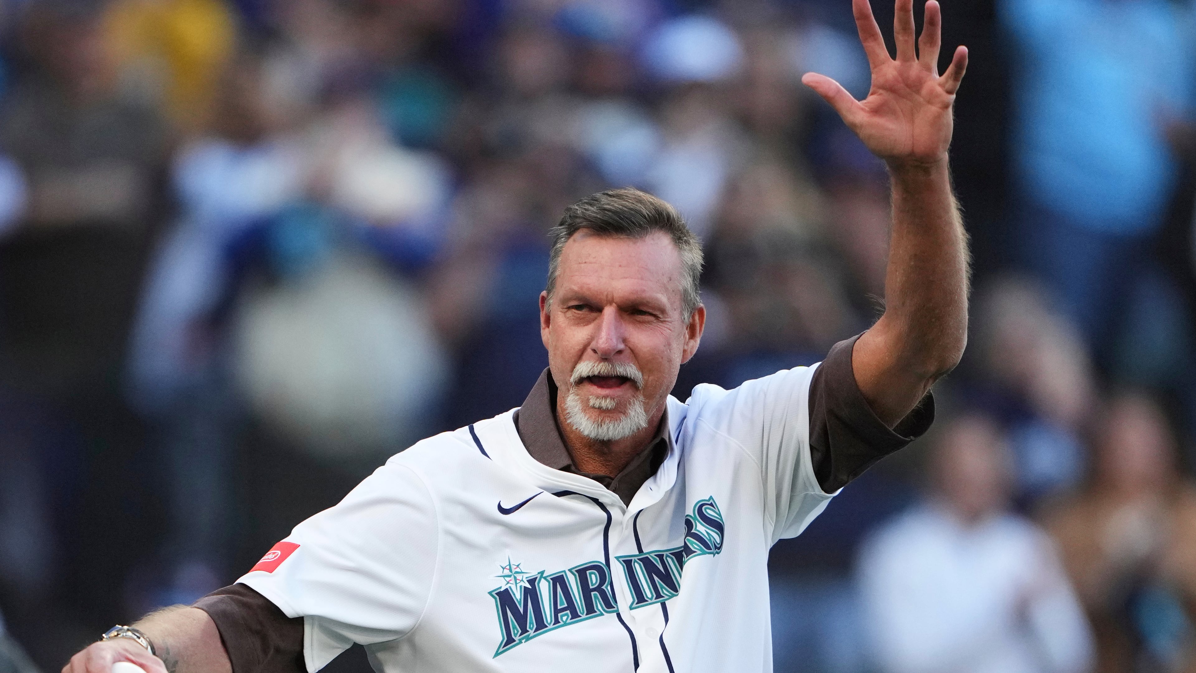 FILE - Baseball Hall of Fame and former Seattle Mariner Randy Johnson waves prior to Game 3 of baseball's American League Championship Series against the Toronto Blue Jays, Wednesday, Oct. 15, 2025, in Seattle. (AP Photo/Lindsey Wasson, File)