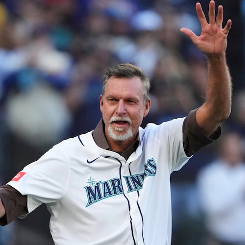FILE - Baseball Hall of Fame and former Seattle Mariner Randy Johnson waves prior to Game 3 of baseball's American League Championship Series against the Toronto Blue Jays, Wednesday, Oct. 15, 2025, in Seattle. (AP Photo/Lindsey Wasson, File)