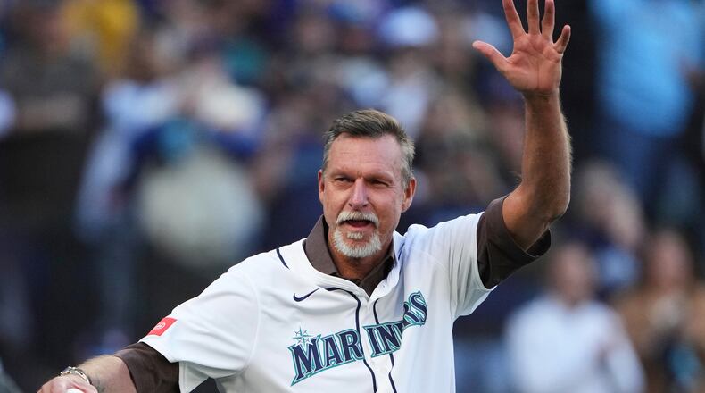 FILE - Baseball Hall of Fame and former Seattle Mariner Randy Johnson waves prior to Game 3 of baseball's American League Championship Series against the Toronto Blue Jays, Wednesday, Oct. 15, 2025, in Seattle. (AP Photo/Lindsey Wasson, File)