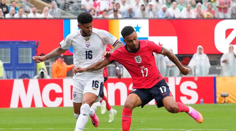 England's Morgan Rogers (17) and Panama's Andres Andrade (16) battle for the ball during the World Cup Group L soccer match between Panama and England in East Rutherford, N.J., near New York, Saturday, June 27, 2026. (AP Photo/Yuki Iwamura)