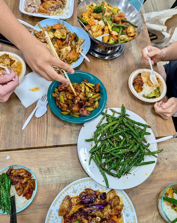 A table full of food from China Kitchen in Chamblee. (Su-Jit Lin for the AJC)