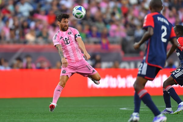 Inter Miami forward Lionel Messi (10) deflects the ball in front of New England Revolution defender Mamadou Fofana (2) during the first half of an MLS soccer match, Wednesday, July 9, 2025, in Foxborough, Mass. (AP Photo/Steven Senne)