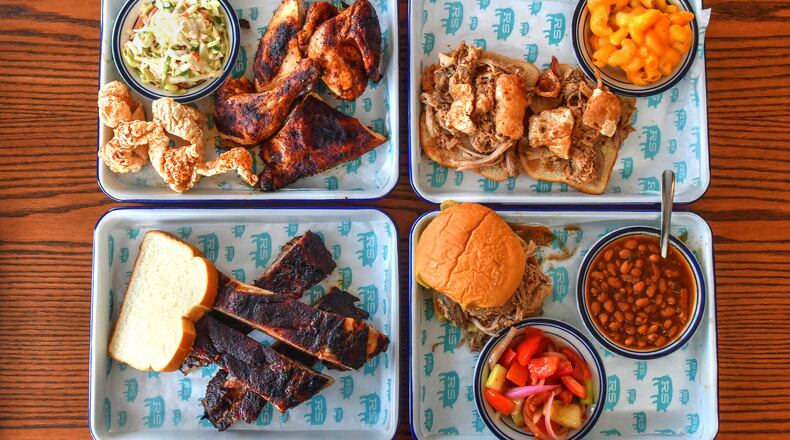 Rodney Scott's Whole Hog BBQ is now open in the Pittsburgh neighborhood near West End in Atlanta, with offerings that include (top row, from left) Collard Greens, Sweet Tea, Ella's Banana Puddin'; (middle row, from left) Pit Cooked 1/2 Bird (chicken) with pork skins and coleslaw, Rod's Original Whole Hog Pork Sandwich "The King of the Menu" with mac and cheese; (bottom row, from left) Pit Cooked Pork Spare Ribs, Pit Cooked Pulled Pork sandwich with tomato cucumber side (seasonal) and baked beans. (Chris Hunt for The Atlanta Journal-Constitution)