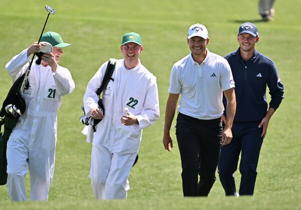 Nicolai Hojgaard (right), and Rasmus Hojgaard walk on the second green during the Par 3 Contest of the Masters golf tournament at Augusta National Golf Club, Wednesday, April 9, 2025, in Augusta. Nicolai and Rasmus Hojgaard will make history Thursday as the first pair of twins to compete in the same Masters.(Hyosub Shin / AJC)