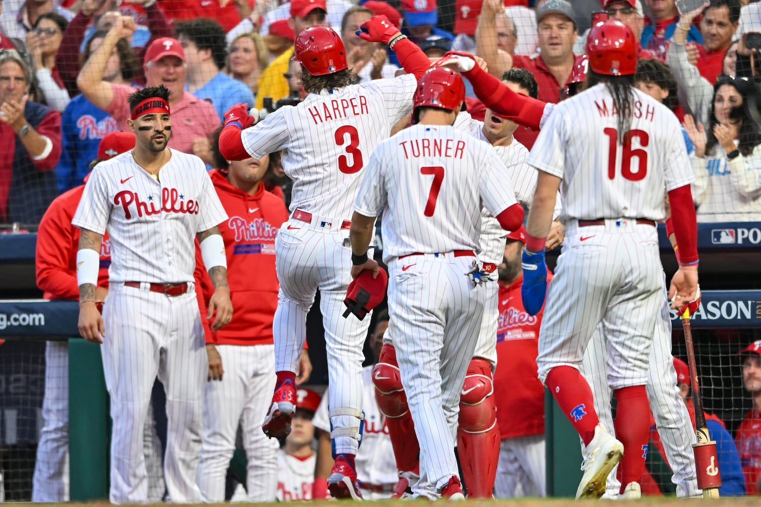 Philadelphia Phillies’ Bryce Harper (3) celebrates a 3-RBI home run against the Atlanta Braves that scored Brandon Marsh (16) and Trea Turner (7) during the third inning of NLDS Game 3 in Philadelphia on Wednesday, Oct. 11, 2023.   (Hyosub Shin / Hyosub.Shin@ajc.com)
