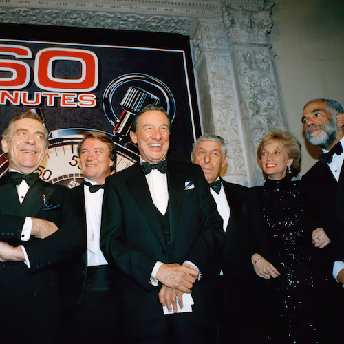 FILE - The "60 Minutes" team, from left, Andy Rooney, Morley Safer, Steve Kroft, Mike Wallace, executive producer Don Hewitt, Lesley Stahl, and Ed Bradley pose at the Metropolitan Museum of Art in New York celebrating their 25th anniversary, on Nov. 10, 1993. (AP Photo/Mark Lennihan, File)