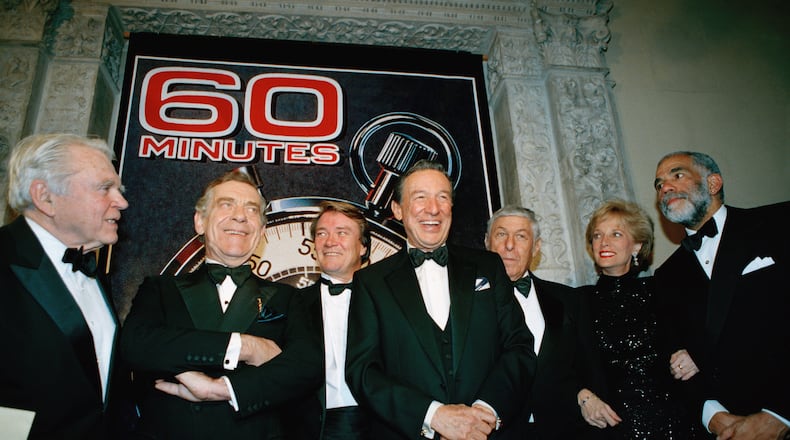 FILE - The "60 Minutes" team, from left, Andy Rooney, Morley Safer, Steve Kroft, Mike Wallace, executive producer Don Hewitt, Lesley Stahl, and Ed Bradley pose at the Metropolitan Museum of Art in New York celebrating their 25th anniversary, on Nov. 10, 1993. (AP Photo/Mark Lennihan, File)