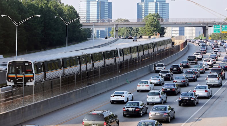A MARTA rail rain rolls on a line in the center of Georgia 400 near Sandy Springs. (AJC file)
