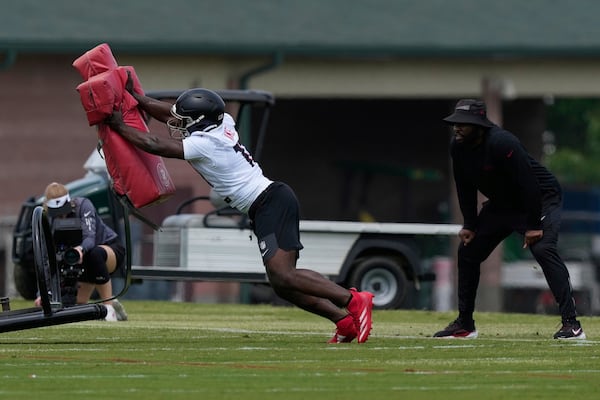 Atlanta Falcons edge rusher Jalon Walker (11) runs drills during the NFL football team's rookie minicamp, Friday, May 9, 2025, in Flowery Branch, Ga. (AP Photo/Brynn Anderson)