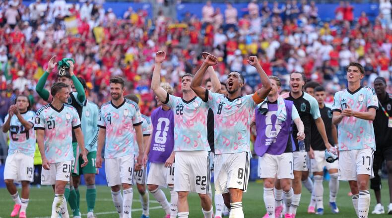 Belgium players celebrate after they won a World Cup round of 16 soccer match against the United States in Seattle, Monday, July 6, 2026. (AP Photo/Abbie Parr)