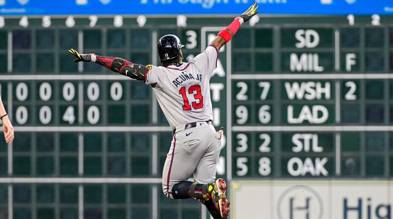 The Atlanta Braves' Ronald Acuna Jr. (13) celebrates after hitting a solo home run in the fifth inning against the Houston Astros at Minute Maid Park on Wednesday, April 17, 2024, in Houston. (Logan Riely/Getty Images/TNS)