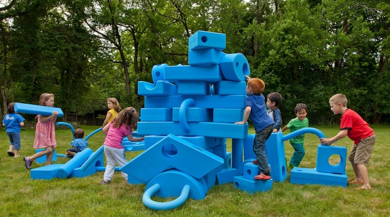Children enjoy creative play with Imagination Playground blocks.