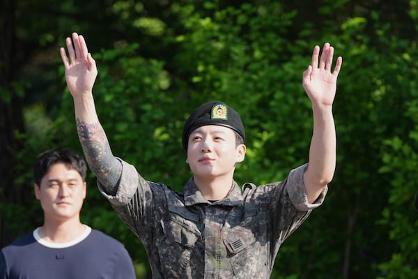 K-pop band BTS members Jung Kook waves after being discharged from a mandatory military service in Yeoncheon, South Korea, Wednesday, June 11, 2025. (AP Photo/Lee Jin-man)