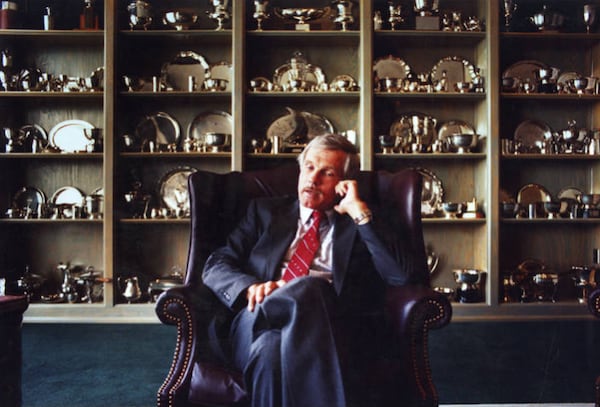 Ted Turner had an office and kept a penthouse at CNN Center. On the shelves behind him are sailing trophies. (Joey Ivansco/AJC 1988)