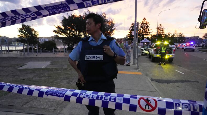 FILE - Police cordon off an area at Bondi Beach after a reported shooting in Sydney, Dec. 14, 2025. (AP Photo/Mark Baker, File)