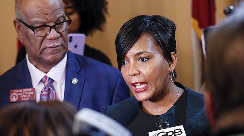 Rep. Calvin Smyre D - Columbus, watches as Atlanta Mayor Keisha Lance Bottoms talks with the media after she addressed the house. The Georgia General Assembly continued with the second legislative day of the 2020 session.
