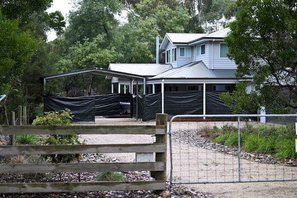 Black plastic surrounds the exterior of the Leongatha home on July 1, 2025, where Erin Patterson allegedly served up a meal with death cap mushrooms in July 2023, in Leongatha, Australia. (James Ross/AAP Image via AP)