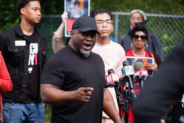 Nolan English with Traveling Grace Ministries speaks during a press conference at the Old Wheat Street encampment in Atlanta on Monday, May 5, 2025. (Natrice Miller/AJC)