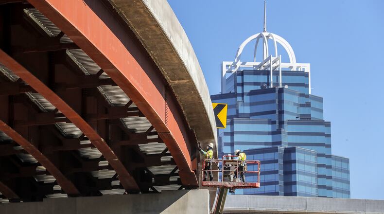 September 22, 2022 Sandy Springs: Construction workers got their last day of summer doing some ramp work in the shadow of the Queen Tower at the Concourse at Landmark Center in Sandy Springs at the new I-285 interchange at Ga. 400 on Thursday, Sept. 22 2022. The United States Department of Transportation recently awarded Sandy Springs grant funding for the Sandy Springs Safety Action Plan as part of the 2022 Safe Streets and Roads for All Grant Program. (John Spink for the AJC)