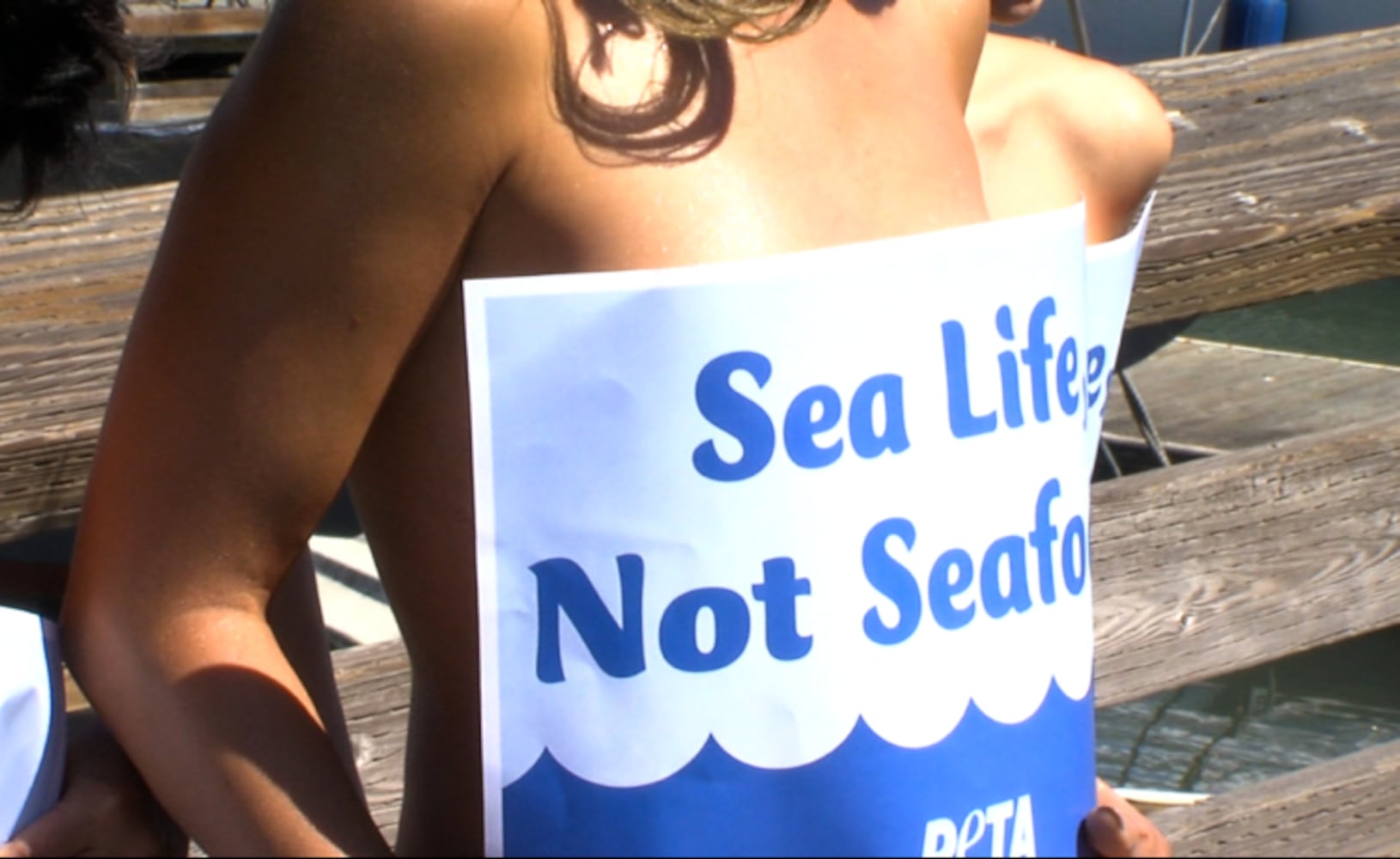 PETA and topless mermaids against seafood