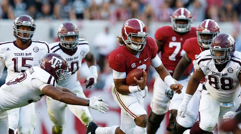 Alabama quarterback Jalen Hurts outruns Texas A&M for a touchdown Saturday. (AP Photo/Brynn Anderson)