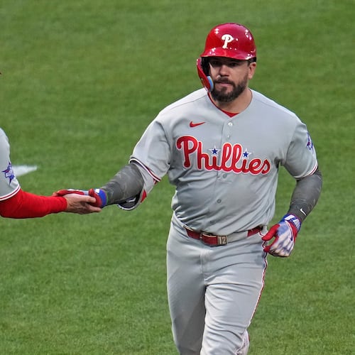 Philadelphia Phillies' Kyle Schwarber, right, rounds third base to greetings from third base coach Anth Contreras (88) after hitting a two-run home run off Pittsburgh Pirates pitcher Braxton Ashcraft during the fifth inning of a baseball game in Pittsburgh, Friday, May 15, 2026. (AP Photo/Gene J. Puskar)
