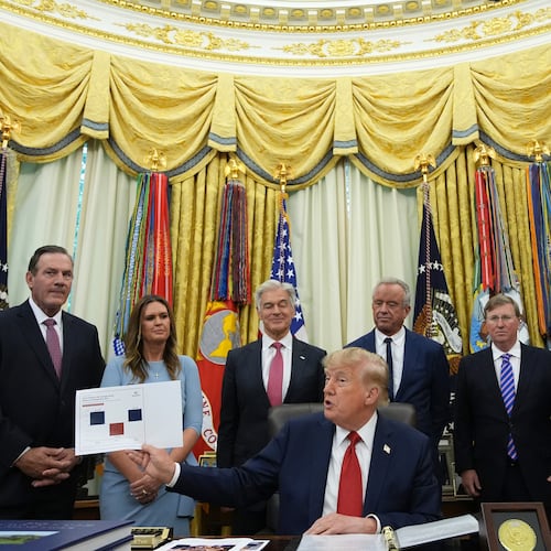 President Donald Trump speaks as South Dakota Gov. Larry Rhoden, from left, Arkansas Gov. Sarah Huckabee Sanders, Mehmet Oz, administrator of the Centers for Medicare & Medicaid Services, Health and Human Services Secretary Robert F. Kennedy Jr., Mississippi Gov. Tate Reeves and Abe Sutton, director of the Center for Medicare and Medicaid Innovation, listen during an event about healthcare in the Oval Office of the White House, Friday Sept. 18, 2026, in Washington. (AP Photo/Jacquelyn Martin)