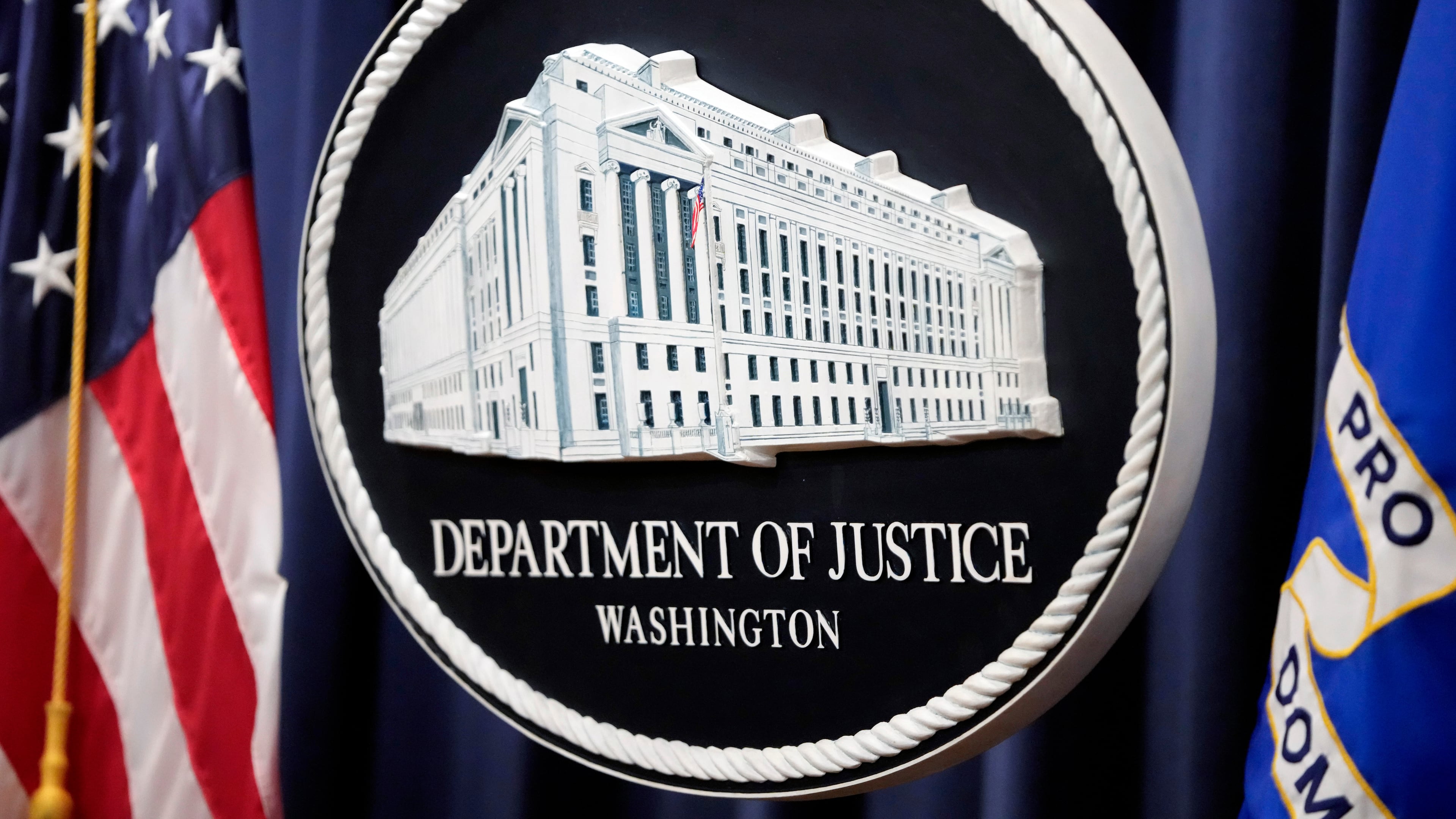 FILE - The logo for the Justice Department is seen before a news conference at the Department of Justice on Aug. 23, 2024, in Washington. (AP Photo/Mark Schiefelbein, File)