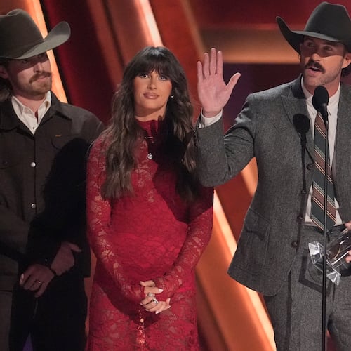 Will Bundy, from left, Ella Langley and Riley Green receive the award for single of the year for "you look like you love me" during the 59th Annual Country Music Association Awards on Wednesday, Nov. 19, 2025, at Bridgestone Arena in Nashville, Tenn. (AP Photo/George Walker IV)