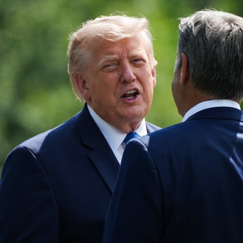 President Donald Trump, left, and CIA Director John Ratcliffe speak as they depart following a cabinet meeting at Camp David, near Thurmont, Md., Friday, July 31, 2026. (Nathan Howard/Pool Photo via AP)