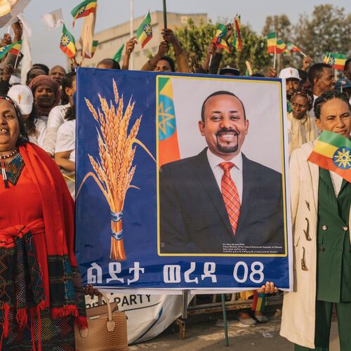 Supporters of Ethiopia's ruling party hold a large portrait of Prime Minister Abiy Ahmed at a rally ahead of the national elections in Addis Ababa, Ethiopia, Tuesday, May 26, 2026. (AP Photo/Amanuel Sileshi)
