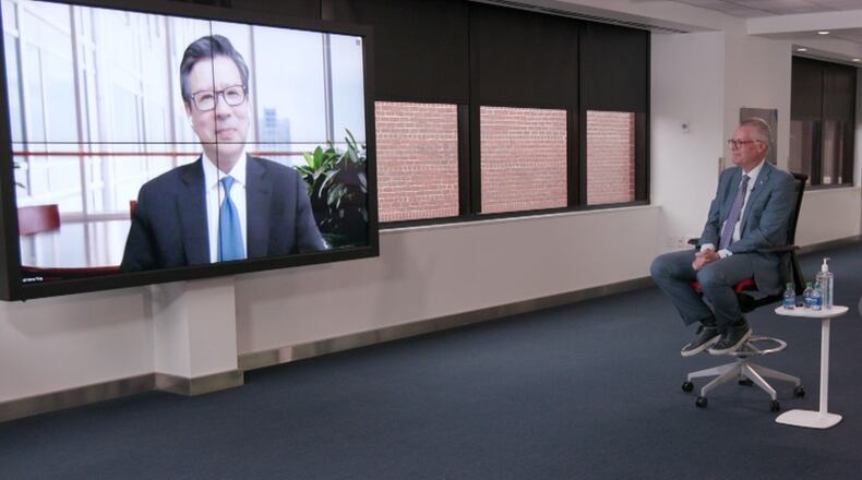 Henry Ting, on the screen, has been named as Delta Air Lines' first chief health officer by CEO Ed Bastian, seated in chair. Source: Delta