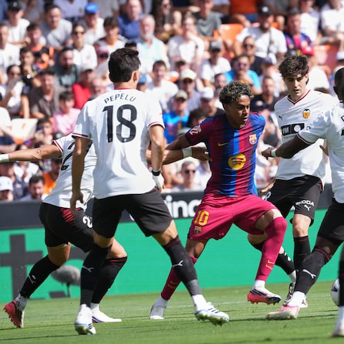 Barcelona's Lamine Yamal fights for the ball during a Spanish La Liga soccer match between Valencia and Barcelona in Valencia, Spain, Sunday, Sept. 6, 2026. (AP Photo/Alberto Saiz)