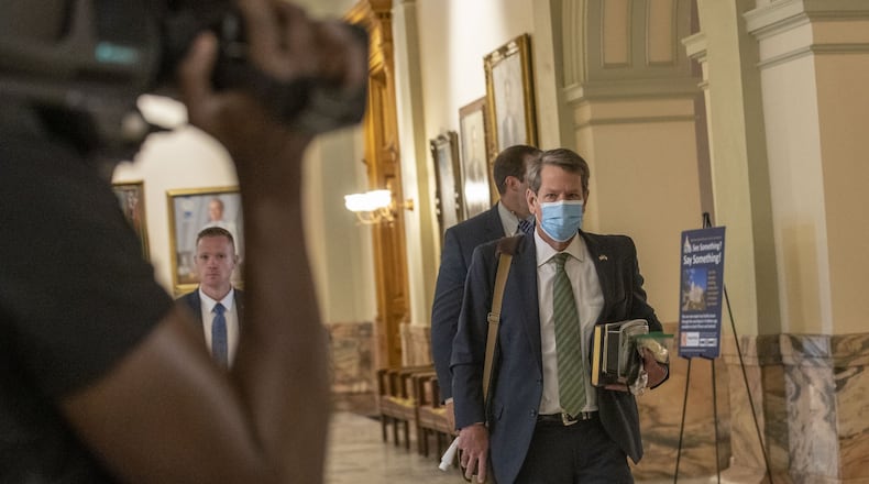 Gov. Brian Kemp arrives at the Georgia Capitol on Monday as members of the Legislature return to restart the legislative session that was suspended to stem the spread of COVID-19. (ALYSSA POINTER / ALYSSA.POINTER@AJC.COM)