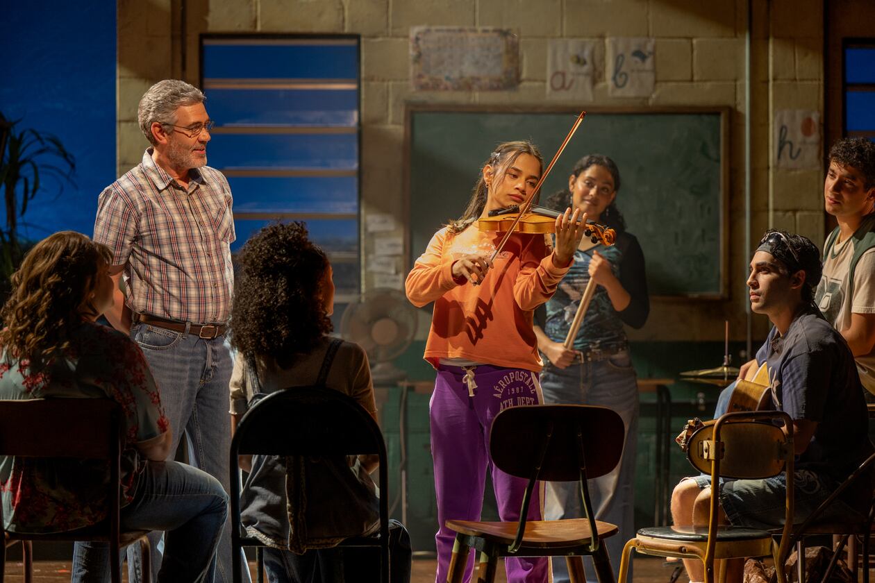Kevin Del Aguila (left) as music teacher Mario, Jaci Calderon as Nambi and other cast members of the world premiere musical "Basura" at the Alliance Theatre. (Greg Mooney/Courtesy of Alliance Theatre)