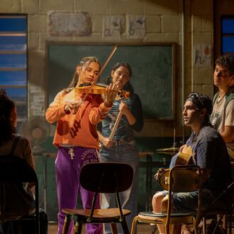 Kevin Del Aguila (left) as music teacher Mario, Jaci Calderon as Nambi and other cast members of the world premiere musical "Basura" at the Alliance Theatre. (Greg Mooney/Courtesy of Alliance Theatre)