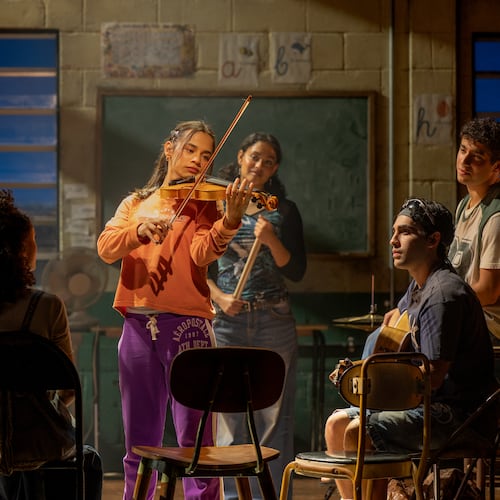Kevin Del Aguila (left) as music teacher Mario, Jaci Calderon as Nambi and other cast members of the world premiere musical "Basura" at the Alliance Theatre. (Greg Mooney/Courtesy of Alliance Theatre)
