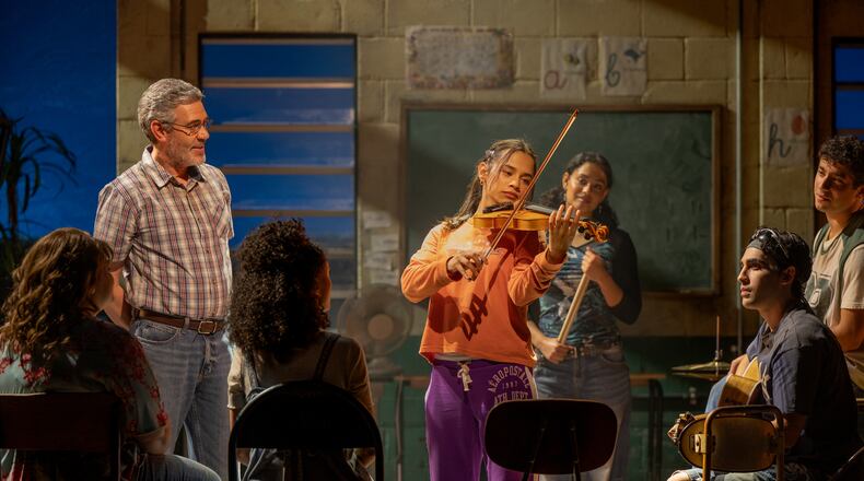 Kevin Del Aguila (left) as music teacher Mario, Jaci Calderon as Nambi and other cast members of the world premiere musical "Basura" at the Alliance Theatre. (Greg Mooney/Courtesy of Alliance Theatre)