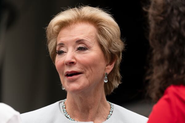 Education Secretary Linda McMahon, talks to her staff as they wait on the North Lawn of the White House for a TV interview, Tuesday, July 15, 2025. (AP Photo/Manuel Balce Ceneta)