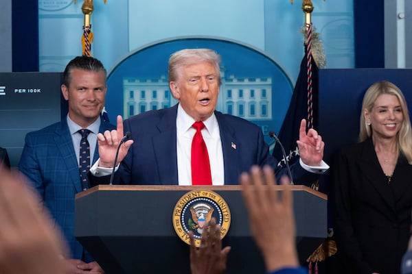 President Donald Trump — flanked by Secretary of Defense Pete Hegseth (left) and and Attorney General Pam Bondi (right) — on Monday announced a federal takover of the police in Washington, D.C., and ordered 800 National Guard troops to the capital to crack down on violent crime and homelessness. (Alex Brandon/AP)