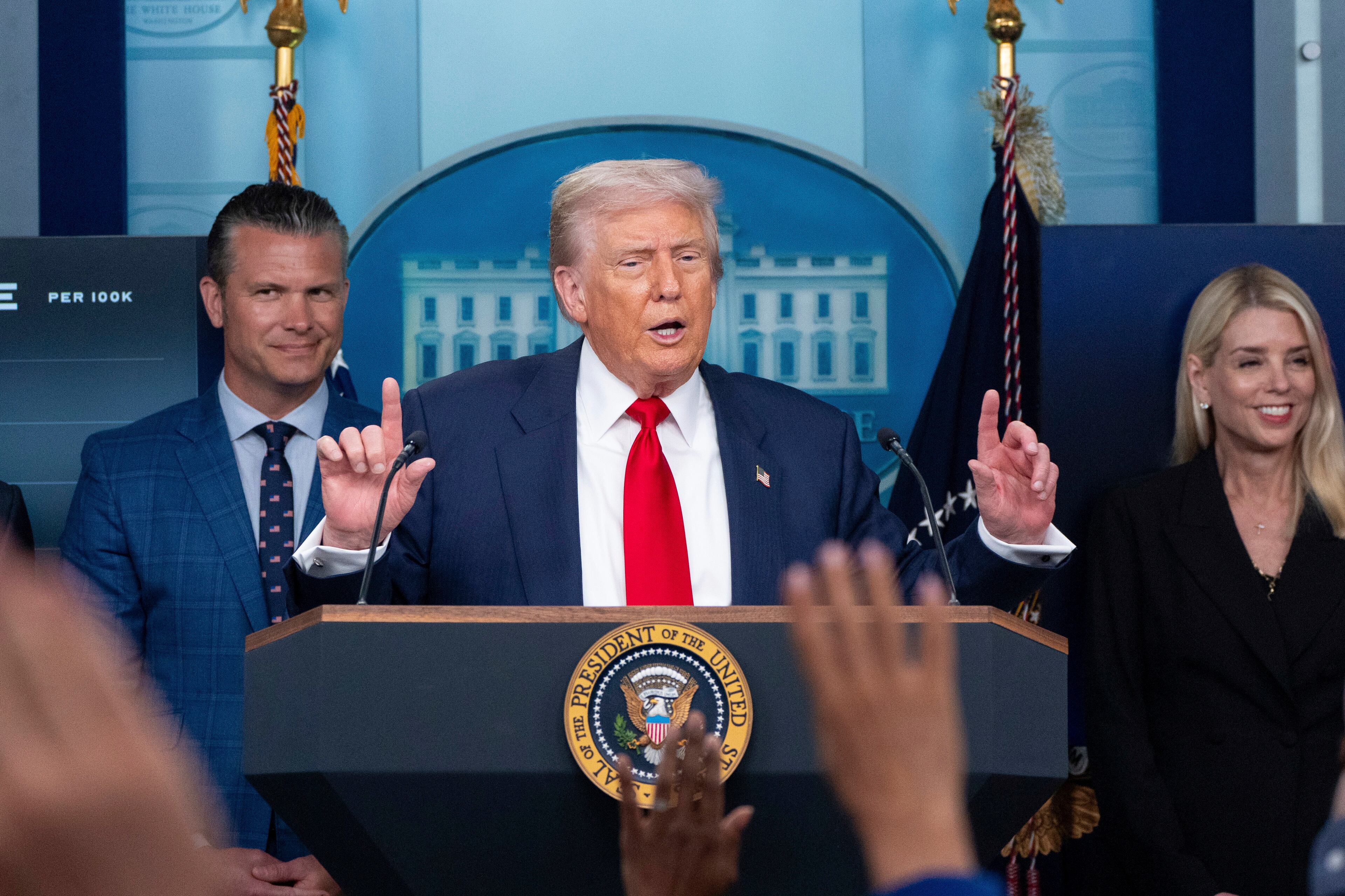 President Donald Trump — flanked by Secretary of Defense Pete Hegseth (left) and and Attorney General Pam Bondi (right) — on Monday announced a federal takover of the police in Washington, D.C., and ordered 800 National Guard troops to the capital to crack down on violent crime and homelessness. (Alex Brandon/AP)