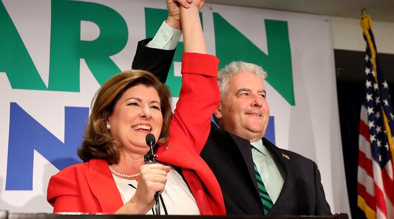 Karen Handel and her husband Steve take the podium for her victory speech at her election night party on Tuesday, June 20, 2017, in Atlanta. Curtis Compton/ccompton@ajc.com